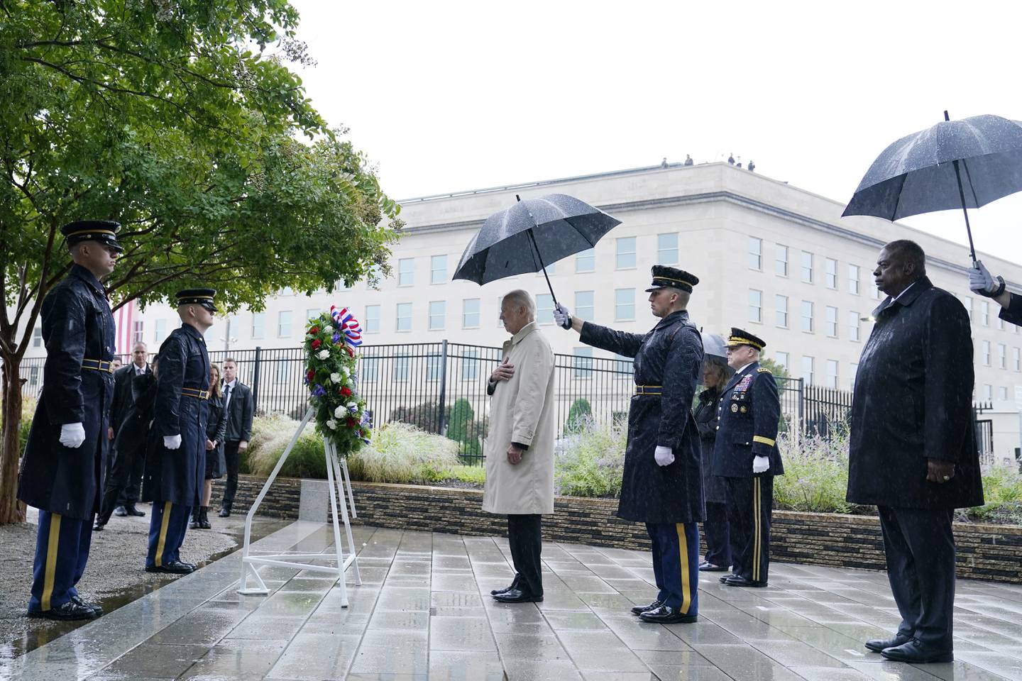 President Joe Biden participates in a wreath laying ceremony while visiting the Pentagon in Washington, Sunday, Sept. 11, 2022, to honor and remember the victims of the September 11th terror attack. Standing with the President are Defense Secretary Lloyd Austin and Chairman of the Joint Chiefs, Gen. Mark Milley.