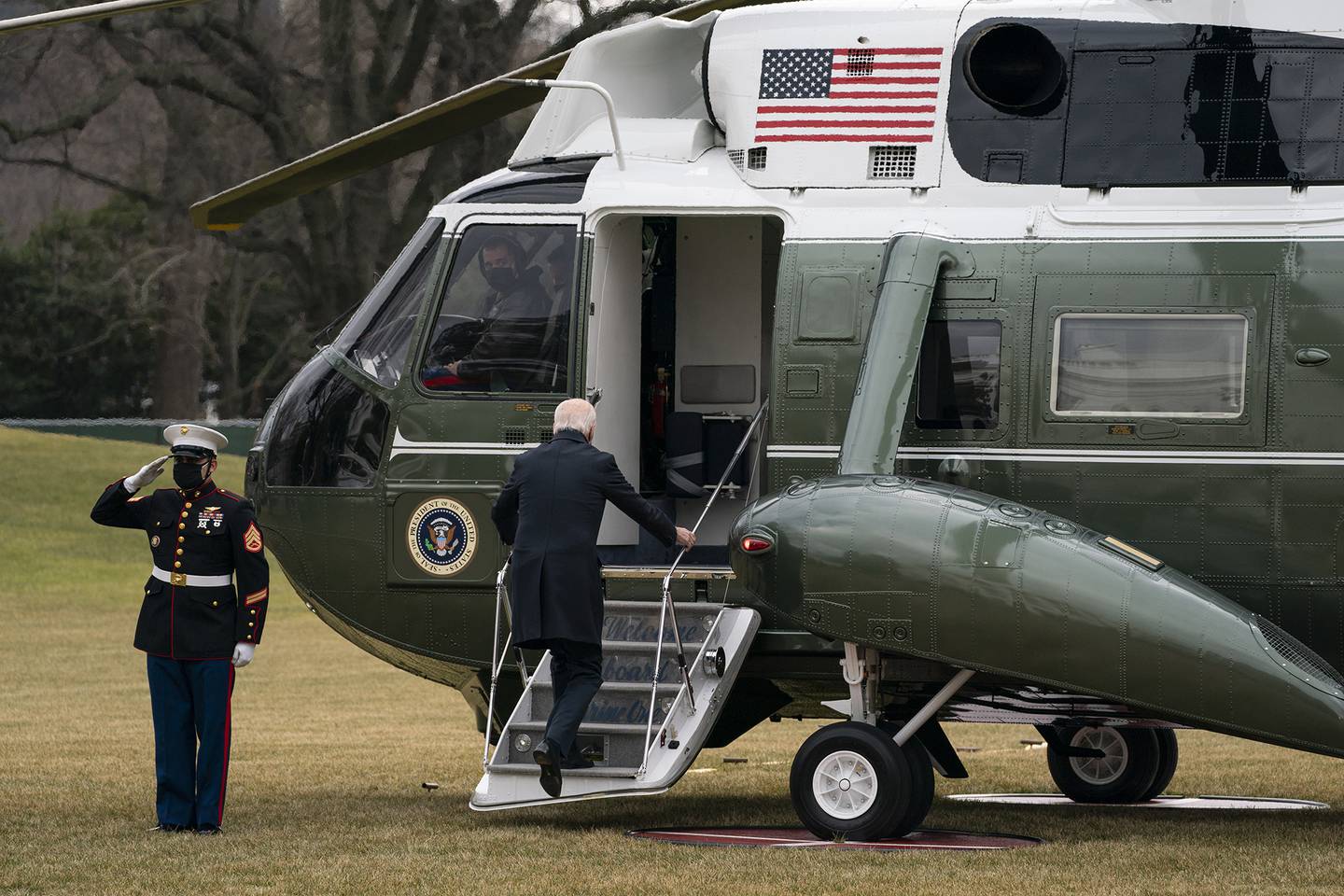 President Joe Biden boards Marine One to visit wounded troops at Walter Reed National Military Medical Center, on the South Lawn of the White House, Friday, Jan. 29, 2021, in Washington.