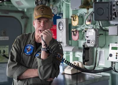 U.S. Navy Vice Adm. Karl Thomas, commander of the 7th Fleet, speaks to the crew of mine-countermeasures ship during a tour in June 2022.