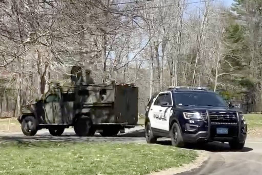 In this image taken from video, police block a road in North Dighton, Mass., Thursday, April 13, 2023.