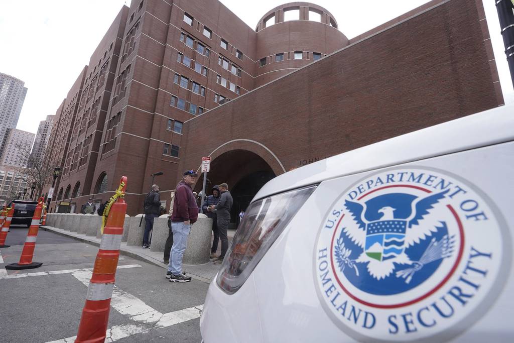 A Homeland Security vehicle, right, is parked outside the Moakley Federal Courthouse, Wednesday, April 19, 2023, in Boston.