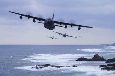 A formation of MC-130J Command IIs flies off the coast of Okinawa, Japan on Jan. 6, 2021.
