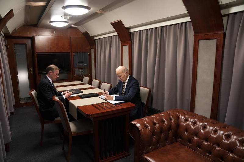 President Joe Biden sits on a train with National Security Advisor Jake Sullivan as he goes over his speech marking the one-year anniversary of the war in Ukraine after a surprise visit with Ukrainian President Volodymyr Zelenskyy, Monday, Feb. 20, 2023, in Kyiv.