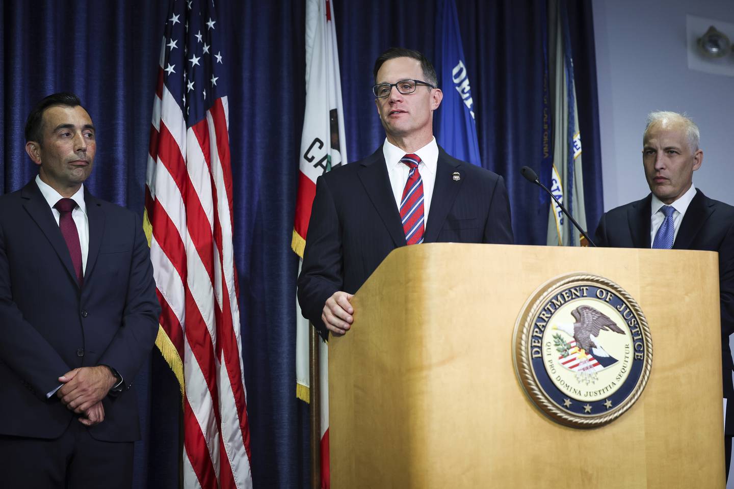 U.S. Attorney Randy S. Grossman for the Southern District of California, center, speaks during a press conference at the U.S. Attorney's Office for the Southern District of California on Thursday, Aug. 3, 2023, in San Diego.