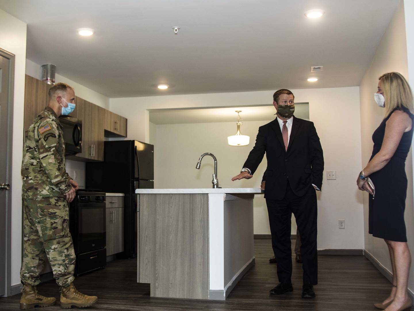 Then-Secretary of the Army Ryan D. McCarthy, center, conducts a walk through of a newly renovated house on Fort Bragg, N.C., Sept. 2, 2020.