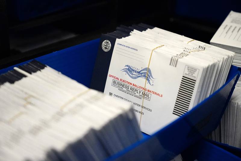 In this Oct. 23, 2020, file photo, mail-in ballots for the 2020 general election in the United States are seen after being sorted at the Chester County Voter Services office, in West Chester, Pa.