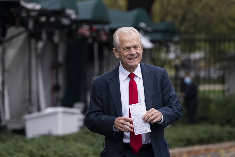 White House trade adviser Peter Navarro holds his notes after a television interview at the White House on Oct. 12, 2020, in Washington.