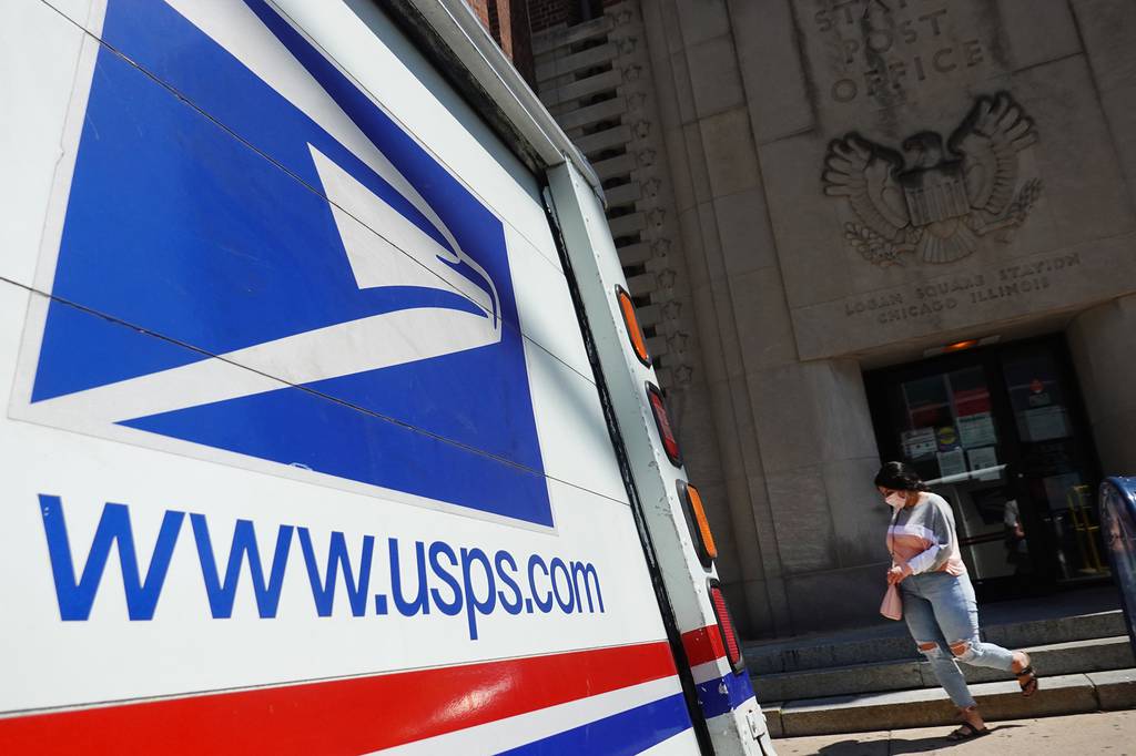 A postal vehicles sits in front of a United State Postal Service facility on Aug. 13, 2020, in Chicago.