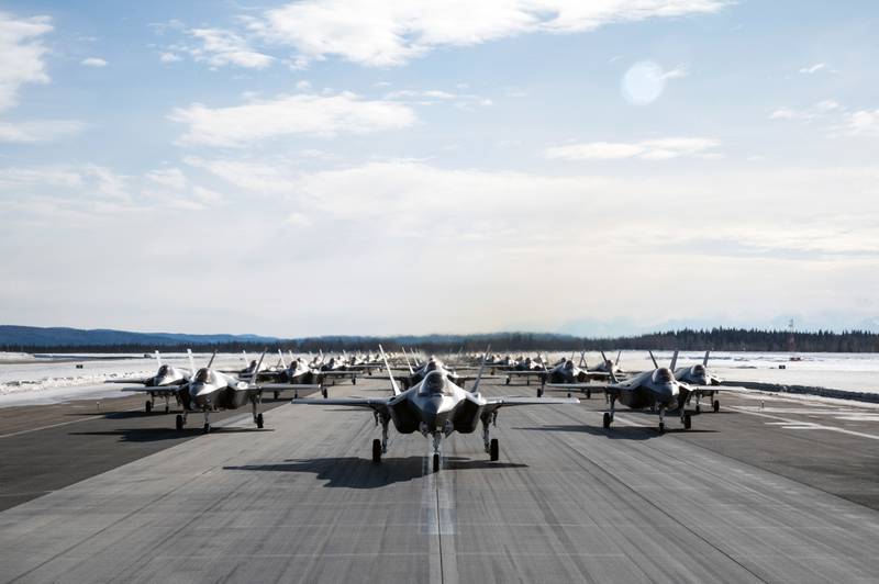 A formation of 42 F-35A Lightning IIs from the 354th Fighter Wing advance down the runway during a routine readiness exercise at Eielson Air Force Base, Alaska, March 25, 2022. (Airman 1st Class Jose Miguel Tamondong/Air Force)