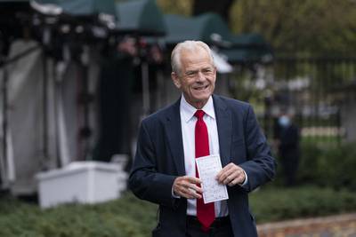 White House trade adviser Peter Navarro holds his notes after a television interview at the White House on Oct. 12, 2020, in Washington.