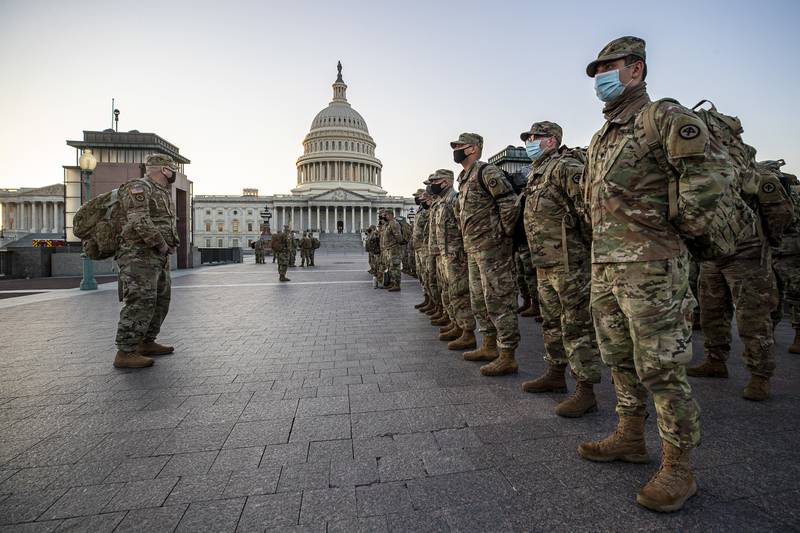 New Jersey National Guard soldiers and airmen from 1st Battalion, 114th Infantry Regiment, 508th Military Police Company, 108th Wing, and 177th Fighter Wing arrive near the Capitol to set up security positions in Washington on Jan. 12, 2021.