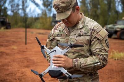 Sgt. Timothy Bella, a geospatial engineer, prepares a Golden Eagle drone for flight during Exercise Bronco Rumble at the Kahuku Training Area, Hawaii, on Aug. 19, 2021.